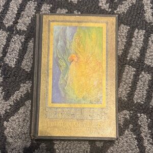 Vintage Decorative Hardcover Book with Gold and Multicolor Artwork